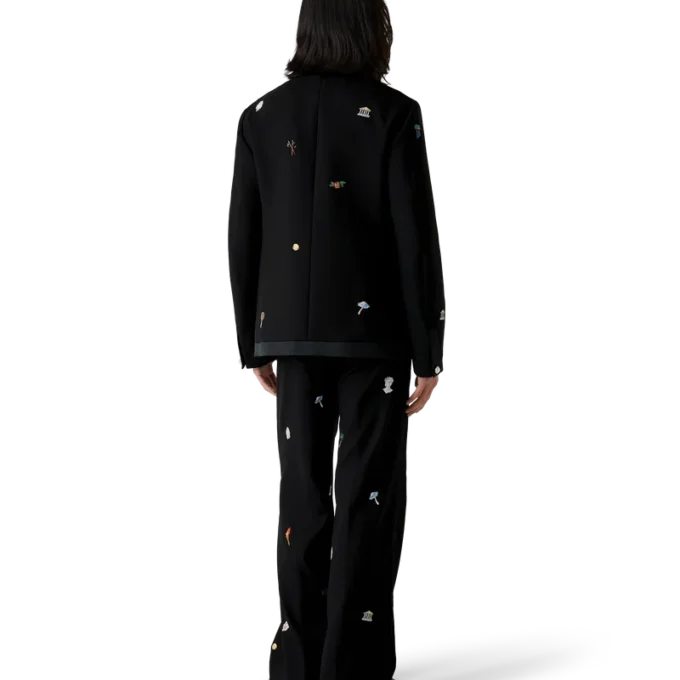 Op maat gemaakte wollen broek met geborduurd motief Op maat gemaakte wollen broek met geborduurd motief