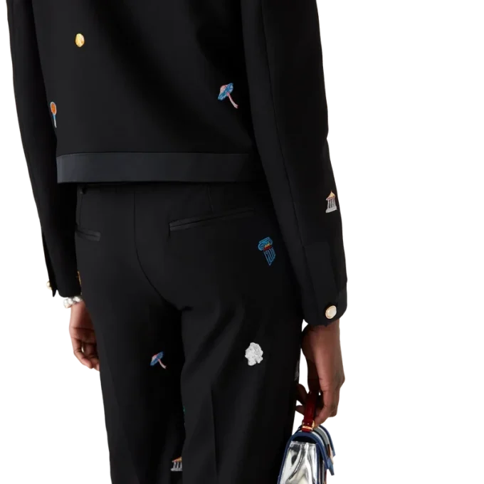 Op maat gemaakte wollen broek met geborduurd motief Op maat gemaakte wollen broek met geborduurd motief